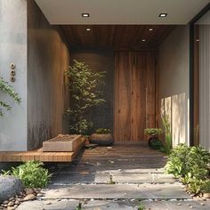 the entrance to a modern house with stone steps