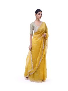 Look like a royalty in this exquisite yellow embroidered organza silk saree at weddings and special occasions. It comes with a beautiful sage green embroidered blouse. Yellow Organza Pre-draped Saree For Reception, Yellow Chanderi Saree For Reception, Yellow Chanderi Traditional Wear For Reception, Yellow Dola Silk Pre-draped Saree For Reception, Yellow Chikankari Embroidery Saree For Reception, Yellow Chikankari Embroidered Dupatta For Reception, Yellow Chikankari Embroidery Dupatta For Reception, Yellow Tissue Silk Traditional Wear For Reception, Yellow Anarkali Style Organza Pre-draped Saree