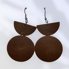 Elevate your style with our exquisite handmade leather earrings. Crafted from high-quality, genuine leather, these earrings boast a perfect blend of elegance and durability. Each pair is meticulously designed to ensure unique, artisanal charm. Featuring either hypoallergenic stainless steel or gold plated stainless steel earring wires, they offer not only a stylish look but also comfort and safety for sensitive ears. Lightweight and comfortable for all-day wear, these earrings make a bold yet so Handmade Minimalist Leather Earrings, Modern Small Hoop Brown Earrings, Modern Brown Small Hoop Earrings, Everyday Brown Metal Earrings, Modern Brown Leather Earrings, Minimalist Nickel-free Brown Earrings, Minimalist Brown Nickel-free Earrings, Nickel-free Brown Circular Jewelry, Minimalist Leather Earrings For Everyday