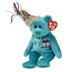 a blue teddy bear wearing a party hat