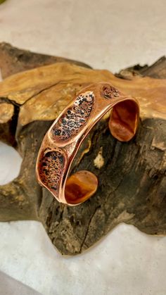 This Custom Hand Hammered Copper cuff Bracelet is a fun project and makes a nice statement. The bracelet Has an ID of 6 1/2" and 7/8" wide and weighs 1.5oz and can be adjusted. I have included a Black Cloth Jewelry Pouch (bag 4"x6") that can carry other "stuff" on those outings, this was my my wife idea and also a nice polish cloth. Unique Hammered Copper Bracelets, Handmade Artistic Copper Bracelet, Artisan Adjustable Copper Cuff Bracelet, Adjustable Hammered Copper Cuff Bracelet, Handmade Rustic Copper Cuff Bracelet, Hand Forged Bronze Copper Cuff Bracelet, Unique Hammered Copper Cuff Bracelet, Artisan Bronze Copper Cuff Bracelet, Electroformed Copper Cuff Bracelet Gift