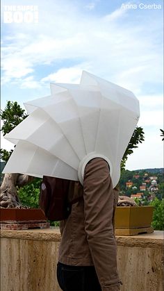 a person holding an umbrella over their head