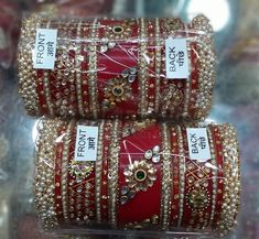 Created Timeless Glamour With Stunning Red Rajwadi Chura Set. Embellished With High Quality Glass Kundan Work. Center Piece Is Decorated With Floral Shape Metal Figures With Glass Kundan Fitting. Pearls Beaded Bangles Are Placed In A Pleasing Manner With Pearls Bunches Bangles At Both End Of This Ensemble. Feel The Moment Of Perfect Appreciation In This Exclusive Creation. This is a set of 30 Bangles (15 For Each Hand). Bollywood Style Traditional Wear With Cutdana For Marriage, Red Kundan Traditional Wear For Puja, Red Kundan Traditional Wear With Stone Work, Red Traditional Wear For Marriage, Red Traditional Marriage Wear, Red Kundan Lehenga For Puja, Heavy Red Dupatta With Traditional Drape, Festive Heavy Red Lehenga, Red Traditional Wear With Pallu For Marriage