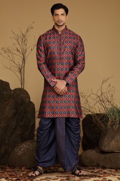 Maroon And Navy Blue Blended Silk Kurta Dhoti Set Traditional  Wear  Care Instructions: Dry Clean Blended silk kurta with Stichline & front potli placket. Top Details: Color- Maroon and Navy Blue, Fabric - Blend slik Bottom Details Color - Navy, Style - free size Dhoti, Fabric -Dhupion Silk Package Include: Kurta and Dhoti Additional Information : -As this Sherwani/Waistcoat/Kurta is stitched & made as per orders requested only, So there is NO RETURN & NO EXCHANGE on this product. Kindly Choose Festive Cotton Silk Bandhgala With Traditional Drape, Blue Chanderi Bandhgala For Wedding, Cotton Silk Bandhgala With Pallu For Transitional Season, Cotton Silk Sherwani With Cutdana In Traditional Drape, Traditional Blue Silk Kurta, Cotton Silk Sherwani For Navratri Festivities, Eid Traditional Drape Kurta With Cutdana, Traditional Cotton Silk Sherwani With Zari Work, Blue Chanderi Sherwani For Diwali