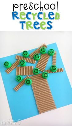 a paper bag with green buttons on it and the words preschool recycled trees