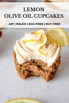 lemon olive oil cupcakes with cream cheese frosting and sliced lemon on top