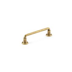 an antique brass pull handle on a white background