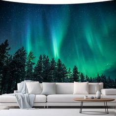 a living room scene with the aurora bore in the sky and trees on the wall