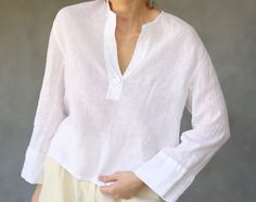 Vintage white pure linen relaxed fit half sleeve shirt blouse top. Long sleeves, single button, no lining. Material feels like pure linen. Fits like size S-M Measured laying flat, double for circumference: 20.5'' / 52 cm long 21'' / 53 cm bust armpit to armpit 20''/ 51 cm waist 17.5'' / 45 cm shoulders 20.5'' / 52 cm sleeve length Great vintage condition. White Linen Button-up Blouse, Relaxed White Linen Blouse, White Linen Tops With 3/4 Sleeve, Relaxed White Linen Shirt, Linen Fits, Half Sleeve Shirts, White Long Sleeve Top, Shirt Blouses Tops, Pure Linen