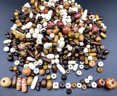 many different types of beads are arranged together