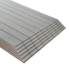 several different types of wood boards stacked on top of each other, one is grey and the other is white