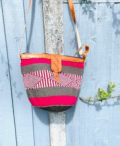 African Kenyan Handmade Traditional sisal tote kiondo handbag. Casual Beach bag Made from sisal Wool and leather handles. The bags are durable And unique. 100% made in Kenya. Measuring about 45  cm wide x 30cm deep. The tote bag is lined inside with black lining. Red Handmade Bucket Bag For Beach, Red Handwoven Pouch Bag, Red Handwoven Crochet Travel Bag, Traditional Satchel Beach Bag, Traditional Satchel Bag For Beach, Traditional Pouch Bag For Vacation, Red Handwoven Satchel Bag, Artisan Beach Bag With Adjustable Strap, Fair Trade Bucket Beach Bag For Travel