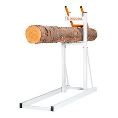 a large piece of wood sitting on top of a white stand