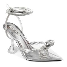 a pair of silver high heeled shoes with bows