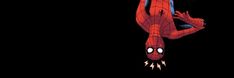 the amazing spider - man is hanging upside down in the dark with his eyes wide open