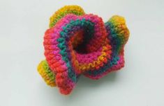 a colorful crocheted object sitting on top of a table