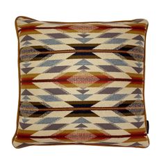 a multicolored pillow with an arrow design on the front and back, sitting on top of a white background