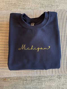 Embroidered University of Michigan crewneck sweatshirt for women SIZING: Please swipe through photos to check the size chart to ensure accurate sizing. If you're looking for a baggy fit, please size up. Orders can be exchanged for a new size but buyer pays shipping, so choose carefully! PROCESSING AND SHIPPING: Sweatshirts are embroidered and shipped between 2-6 business days. Shipping typically takes an additional 3-5 business days. If you're in a rush, please message me when you place your order and I'll see what I can do to speed up the process! RETURN/EXCHANGE POLICY: As a small business, I can't accommodate returns at this time. However, if you have concerns or if a mistake is made, please reach out right away and I will correct the error. You may exchange for a different size within University Of Michigan Game Day Outfits, University Sweatshirt Outfit, Michigan Game Day, University Of Michigan Sweatshirt, Michigan Sweatshirt, University Sweatshirts, Sweatshirt For Women, Go Blue, Sweatshirt Women