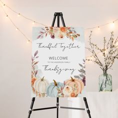 an easel with a welcome sign on it