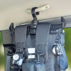 there are two cameras attached to the back of a car's rear seat belt