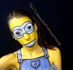 a woman with yellow face paint and blue overalls