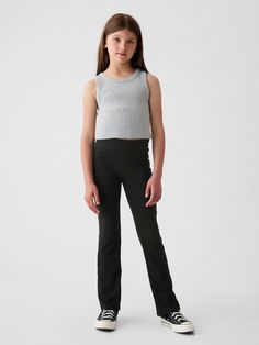 Soft, stretch knit flare leggings.  Elasticized waist.  Certain styles have allover prints.  Easy, pull-on waist.  Slim through the hip and thigh.  Flares at the ankle. Flared Leggings, Cotton Leggings, Gap Kids, Flare Leggings, Gap, Organic Cotton, Leggings, Knitting, Black