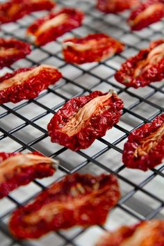 some red peppers are on a wire rack and ready to be cooked in the oven