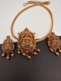 Goddess Lakshmi Ganesha Nakshi Matte Finish Pendent Set Festive Gold Sets For Puja, Gold Kundan Sets For Rituals, Gold Meenakari Sets For Navratri, Temple Jewelry Gold Jewelry Set For Puja, Temple Jewelry Sets For Puja And Diwali, Gold Temple Jewelry Set For Puja, Gold Chandbali Sets For Puja, Temple Jewelry Sets For Diwali Puja, Gold Sets For Puja And Festive Occasions