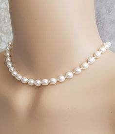 A string of pearls are a timeless classic wardrobe piece of jewellery, that suits all occasions. This beautiful 14 inch necklace is handmade using good quality German silk cord. AA quality 7.5mm x 8.5mm white freshwater cultured pearls with very good lustre, hand knotted between each pearl, to give the necklace a natural drape and to stop the pearls from rubbing against each other. Finished with a gold filled clasp findings and an extension chain. The pearls are genuine freshwater pearls therefo String Of Pearls Necklace, Classic Bridal Necklace With Pearl Charm, Elegant White 16 Inch Pearl Necklace, Classic Adjustable 16 Inch Necklace, Classic Adjustable Necklace With Pearl Charm, Classic Adjustable Pearl Charm Necklace, Adjustable Pearl Charm Necklace For Formal Occasions, Adjustable Pearl Chain Necklace For Anniversary, Classic Oval Pearl Necklace