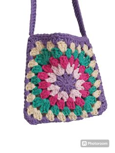 a crocheted bag is shown on a white background