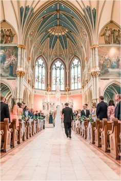 the bride and groom are walking down the aisle