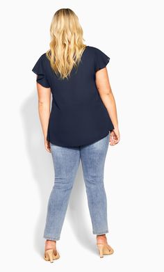 The navy Zip Fling Top is back and better than ever. With a working zip V-neckline, cute flutter sleeves and a relaxed fit style, this top is perfect for nights out on the town or completing your office outfits. Key Features Include: - V-neckline with functional zip - Short flutter sleeve - Double layer front - Relaxed fit - Hip length hemline - Lightweight woven fabrication Tuck it into a pencil skirt with some heels for work. | Plus Size Zip Fling Top in Navy, Size 16 | City Chic The Navy, Plus Size Top, Basic Tops, Fit Style, Chic Woman, City Chic, Fashion Help, Flutter Sleeves, Office Outfits