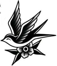 a black and white bird with flowers on it