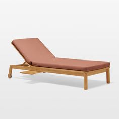 a single chaise lounge chair with an orange cushion on the back and legs, viewed from the side