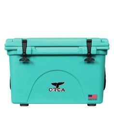 an aqua colored cooler with black handles and two wheels on the side, sitting against a white background