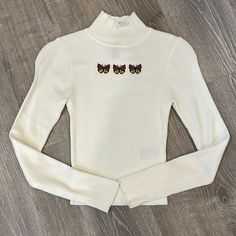 White Ribbed Sweater With Butterfly Embroidery Mock Turtle Neck New Without Tags White Ribbed Sweater, Hm Sweater, Mock Turtle Neck, Butterfly Embroidery, Mock Turtle, Mock Turtleneck, Ribbed Sweater, Colorful Sweaters, The Social