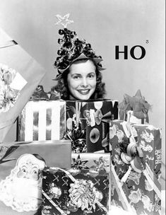 black and white photograph of a woman surrounded by presents