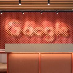 an office lobby with red brick walls and lights