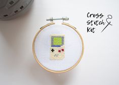 the cross stitch kit is ready to be sewn and put in an embroidery hoop