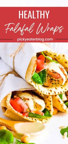 healthy falafel wraps with tomatoes, lettuce and cheese on top