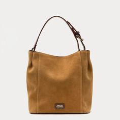 The petite version of one of our best-selling handbags, the Small June offers an effortless slouch silhouette in soft suede that makes carrying essentials as fabulous as everything else in life. Complete with a leather handle, center snap (for keeping secrets safe!), and a detachable crossbody strap—perfect for those "hands-free and fabulous" moments. Slouchy suede hobo tote Leather handle, center snap, & detachable crossbody strap Features unique tea-stained leather edges Back zip pocket with t Secret Safe, Keeping Secrets, Unique Tea, Handbag Shoes, Hobo Handbags, New Handbags, Soft Suede, Leather Handle, Handbag Accessories