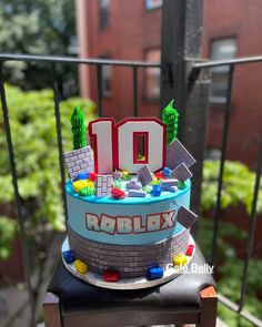 a cake that is sitting on top of a chair with the number 10 on it