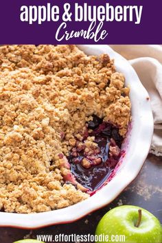 an apple and blueberry crumble in a white dish