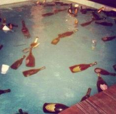 there are many bottles in the water and on the floor, all filled with them