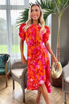 Stay on trend with this pink and orange floral printed midi dress from AX Paris. Featuring short puff sleeves, a round neckline, a zip-up back, and a high-low style skirt with a gathered side detail. Style with flats or heels and add some sophisticated jewellery for a chic evening look. Short Puff Sleeve, Playsuit Dress, Black Dress Prom, Paris Print, 21st Dresses, Uk Clothing, Maxi Dress Cocktail, Midi Dress Party, Orange And Pink