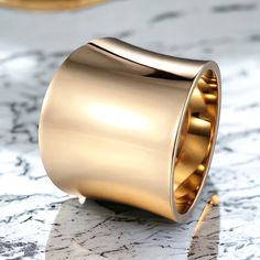 This very elegant 18k gold statement ring is not only a significant statement piece, it can look great on any had. The wide band design makes it a modern design and great addition to your gold layers of rings. Modern Gold Wide Band Open Ring, Elegant Wide Band Ring With Thick Metal Band, Luxury Wide Band Diamond Ring, Formal Gold Thick Band Wide Ring, Formal Gold Wide Band Ring, Modern Gold Wide Band Ring For Formal Occasions, Modern Wide Band Gold Ring For Formal Occasions, Rose Gold Wide Band Ring With Polished Finish, Formal Wide Band Diamond Ring