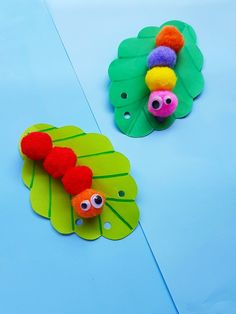 two paper plates with different types of decorations on them, one in the shape of a caterpillar and one in the shape of a leaf