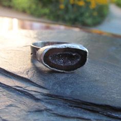 "Silver Druzy Geode Ring Sparkling Geode Ring Silver Sparkly Red Black Druzy Ring: A stunning, one-of-a-kind, handmade stackable ring featuring a natural sparkling druzy geode set in silver. The geode is black, red and gray and it measures 11/16\" by 7/16\". Band is a little over 3/16\" wide. The ring itself is a size 7. Completely handmade by myself. Enter my shop: https://www.etsy.com/shop/artdi Join me on Facebook: https://www.facebook.com/Artdi-Diana-Anton-Jewelry-Design-44805607932/ Find me Silver Open Ring Halo With Gemstone, Silver Halo Ring With Gemstone And Open Design, Silver Open Halo Ring With Gemstone, Open Ring With Large Stone For Anniversary, Anniversary Rings With Large Stone And Open Ring Design, Anniversary Ring With Large Stone And Open Setting, Anniversary Ring With Large Stone And Open Design, Anniversary Open Ring With Large Stone, Silver Gemstone Ring With Open Band