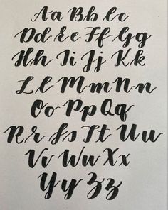 some type of calligraphy that has been written in black ink and is on white paper