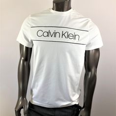 Calvin Klein White Tee With Black Logo. 95% Cotton And 5% Elastane Modern Logo Tops For Summer, Modern Summer Tops With Logo, Calvin Klein White Logo Print T-shirt, Black Logo Tops For Spring, Spring Cotton Tops With Logo, Spring Cotton Top With Logo, Logo Fitted Crew Neck Top, Calvin Klein Logo Cotton Tops, Calvin Klein Cotton Logo Tops